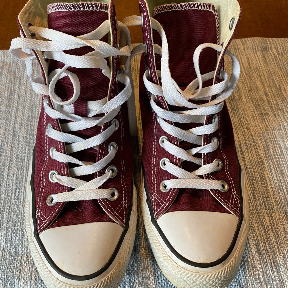 Very good condition burgundy Converse high tops. Women’s size 8.5.